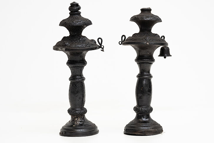  Two Torah finals, partly charred.