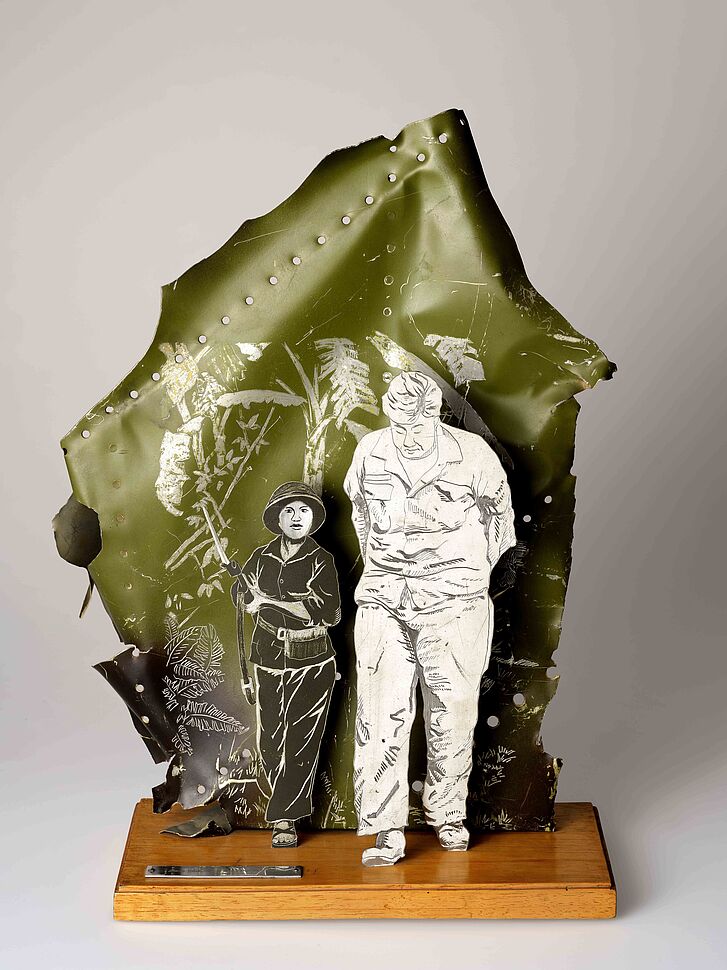 Two figures on a wooden base