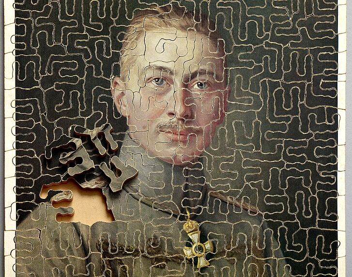 Puzzle mit Porträt eines Mannes.