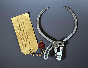 Craniometer (Instrument for measuring the Circumference of the Skull), found in the Dachau Concentration Camp (with Inventory Sheet and Seal of the US Army), 1933-1945. Craniometer (Instrument For Measuring the Circumference of the Skull), Found in the Dachau Concentration Camp (with Inventory Sheet and Seal of the US Army), 1933-1945. (Inv.Nr. AK 2001/318)